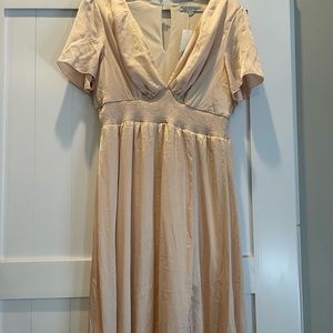 Tan colored Baltic Born dress. Floor length.